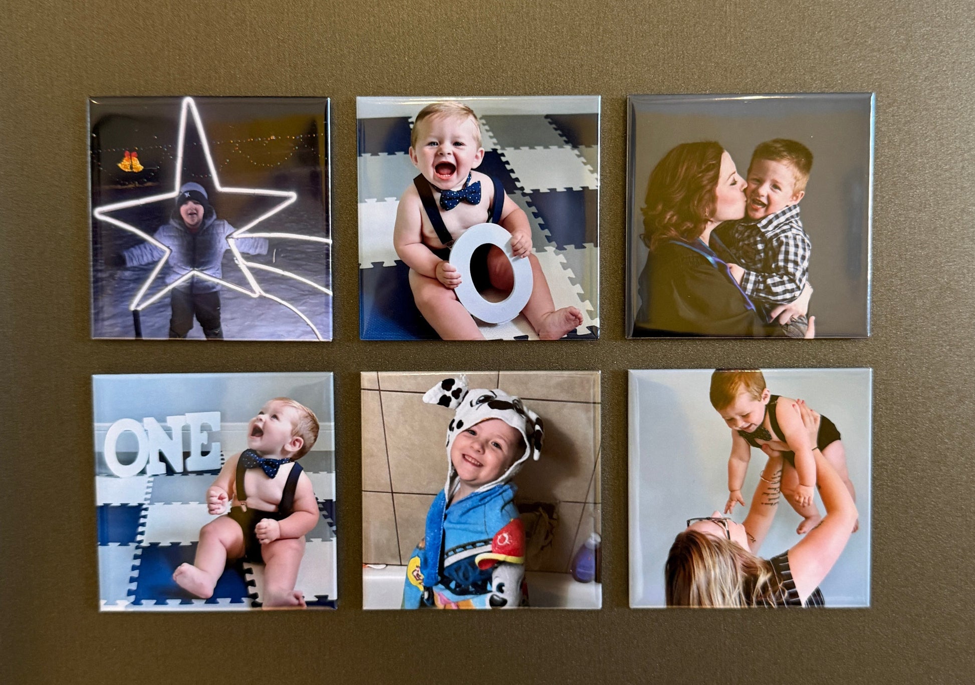 Custom photo magnets with family photos styled on a warm background